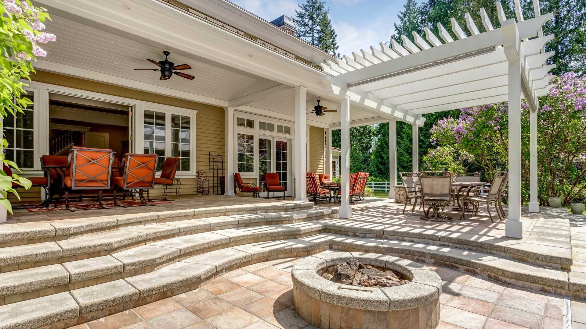 There is a fire pit in the middle of the patio.