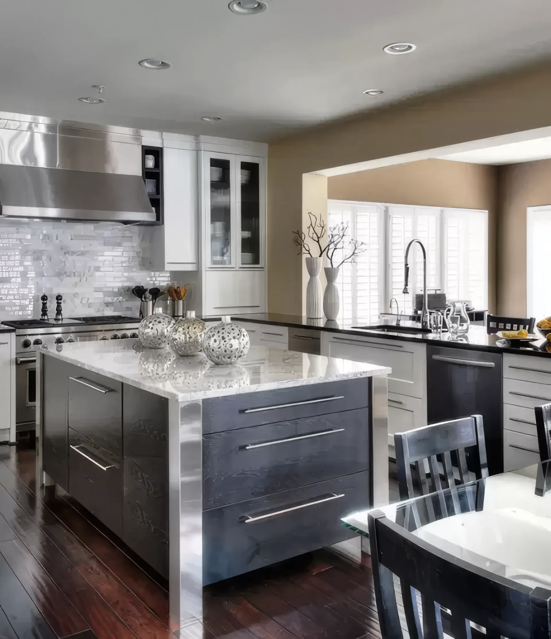 A kitchen with stainless steel appliances and a large island