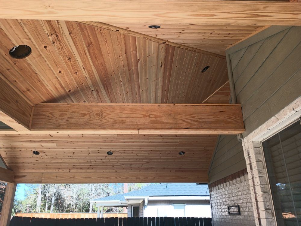 A house with a wooden ceiling and a brick wall