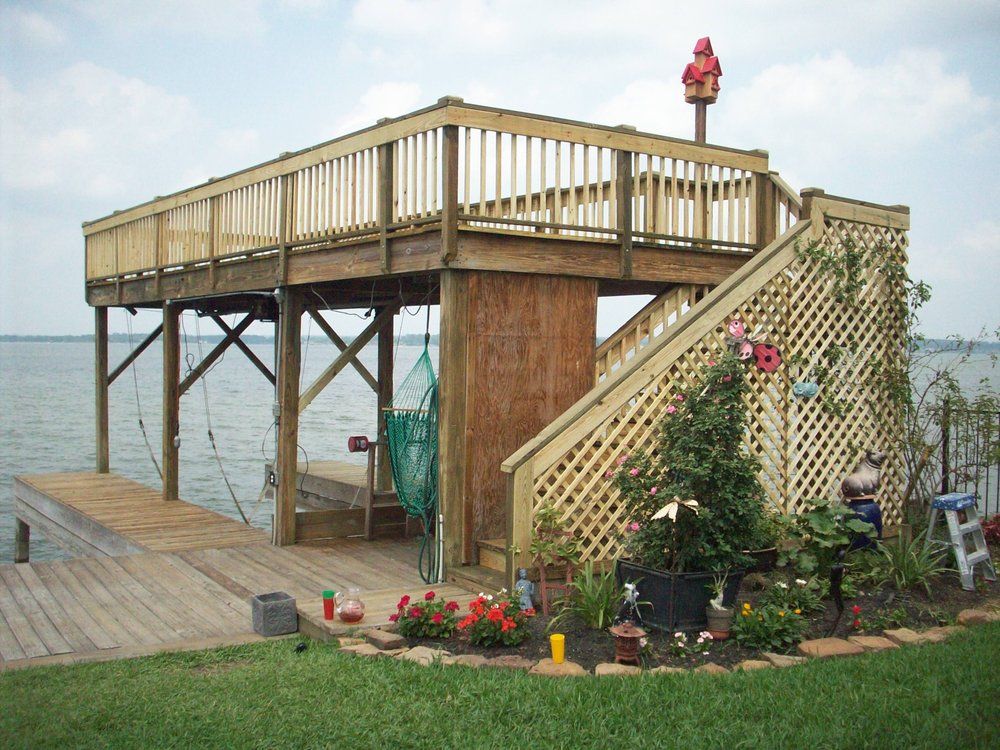A wooden deck overlooking a body of water