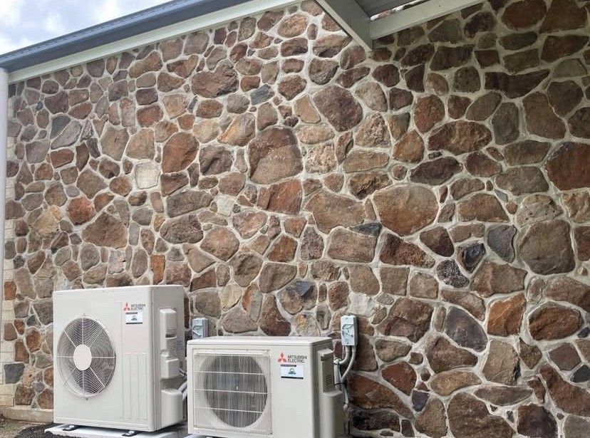 A House With  Air Conditioner On The Side Of It — Frigid-Air PTY Ltd In South Lismore, NSW