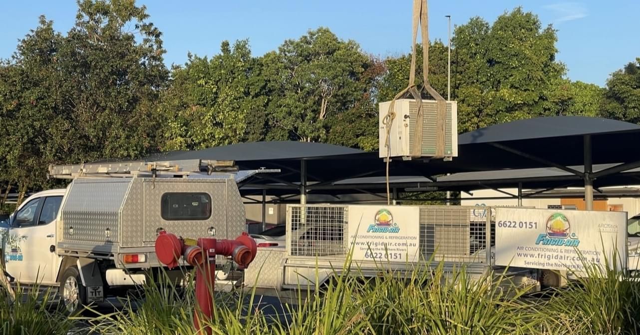 A White Truck With The Word Aqua On The Side Is Parked Next To A Fire Hydrant — Frigid-Air PTY Ltd In Byron Bay, NSW