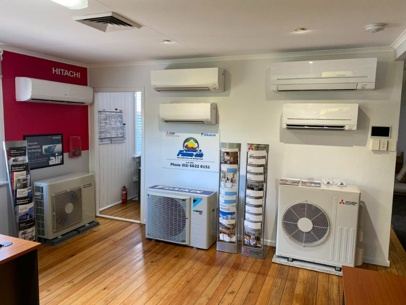 Room With A Lot Of Air Conditioners On The Wall 
— Frigid-Air PTY Ltd In South Lismore, NSW