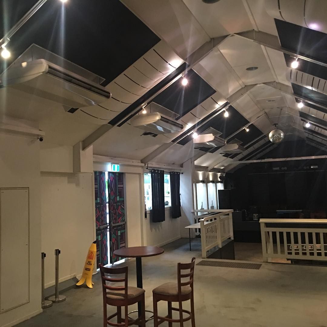An Empty Room With A Yellow Caution Sign On The Floor — Frigid-Air PTY Ltd In South Lismore, NSW