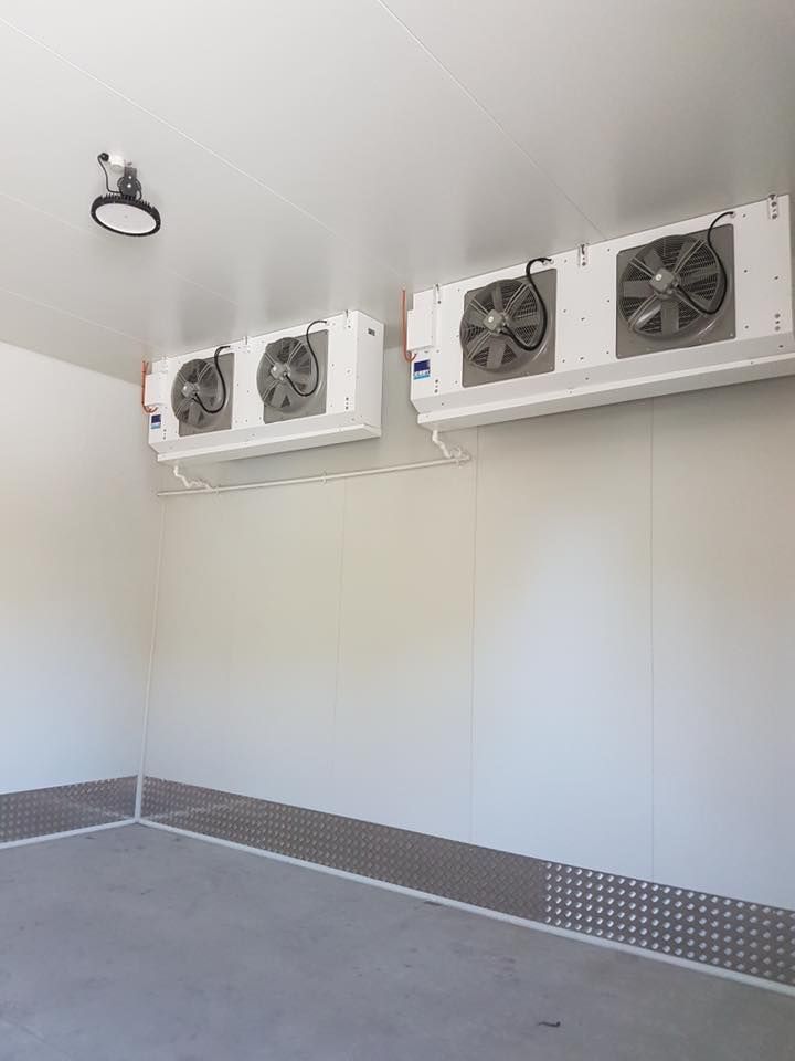 There Are Two Fans Hanging From The Ceiling Of A Room — Frigid-Air PTY Ltd In Ballina, NSW