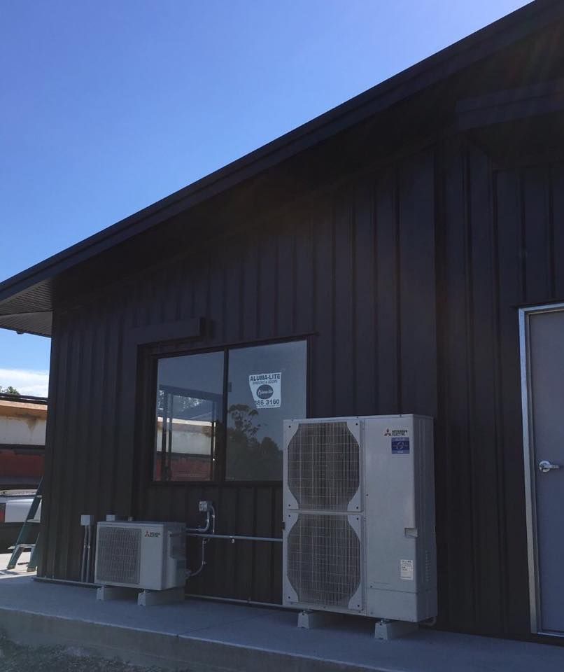 A Building With Two Air Conditioners On The Side Of It — Frigid-Air PTY Ltd In South Lismore, NSW