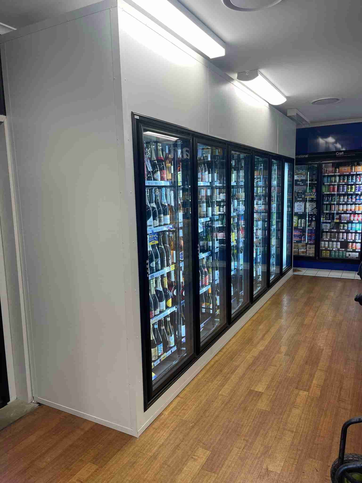 A Row Of Refrigerators Filled With Lots Of Beer In A Store — Frigid-Air PTY Ltd In South Lismore, NSW