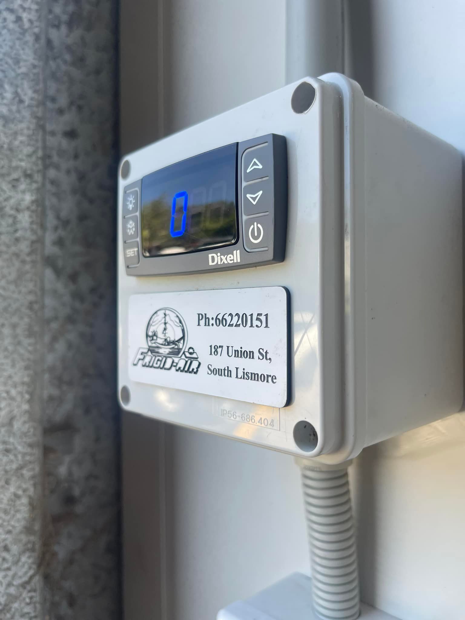 A White Box With A Clock On It Is Attached To A Wall — Frigid-Air PTY Ltd In South Lismore, NSW