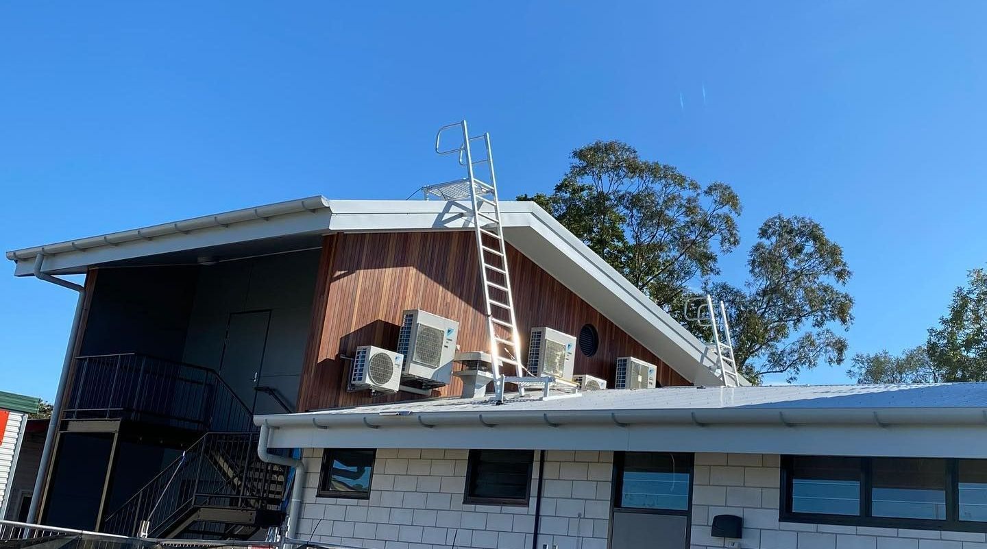 There Is A Ladder On The Roof Of A House — Frigid-Air PTY Ltd In Evans Head, NSW
