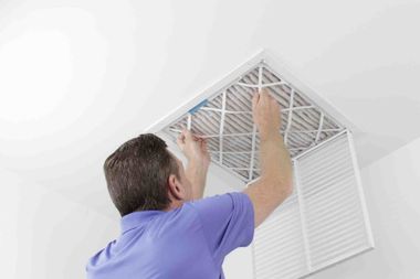 Person Removing Ceiling Air Filter  — Chicago, IL  —  A Proficient Heating & Air Conditioning