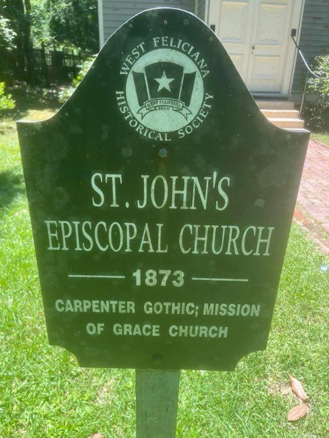 Sign for St. John's Episcopal Church, West Feliciana. Green with white text; mentions Carpenter Gothic style, 1873.