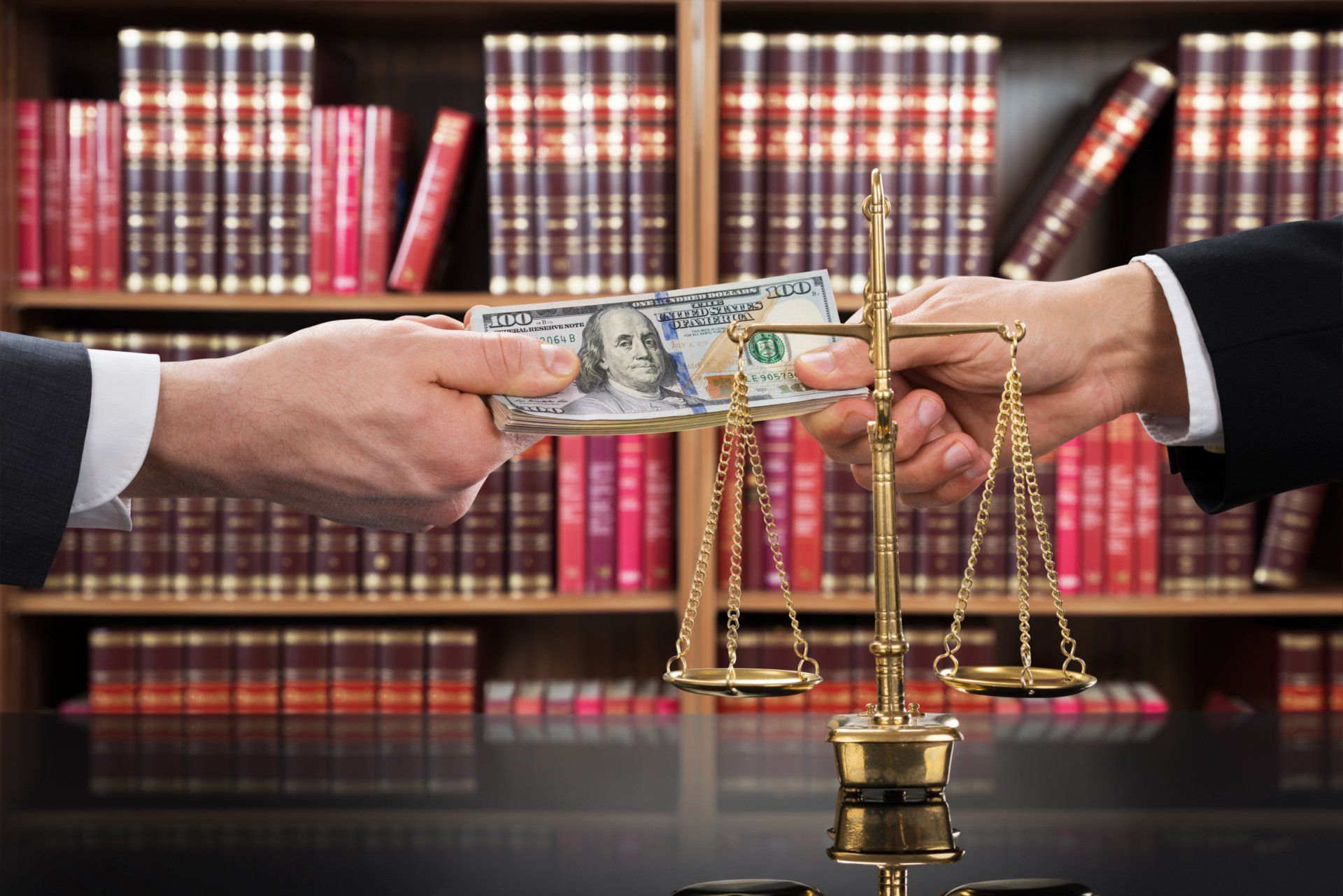 exchanging-money-in-front-of-law-books