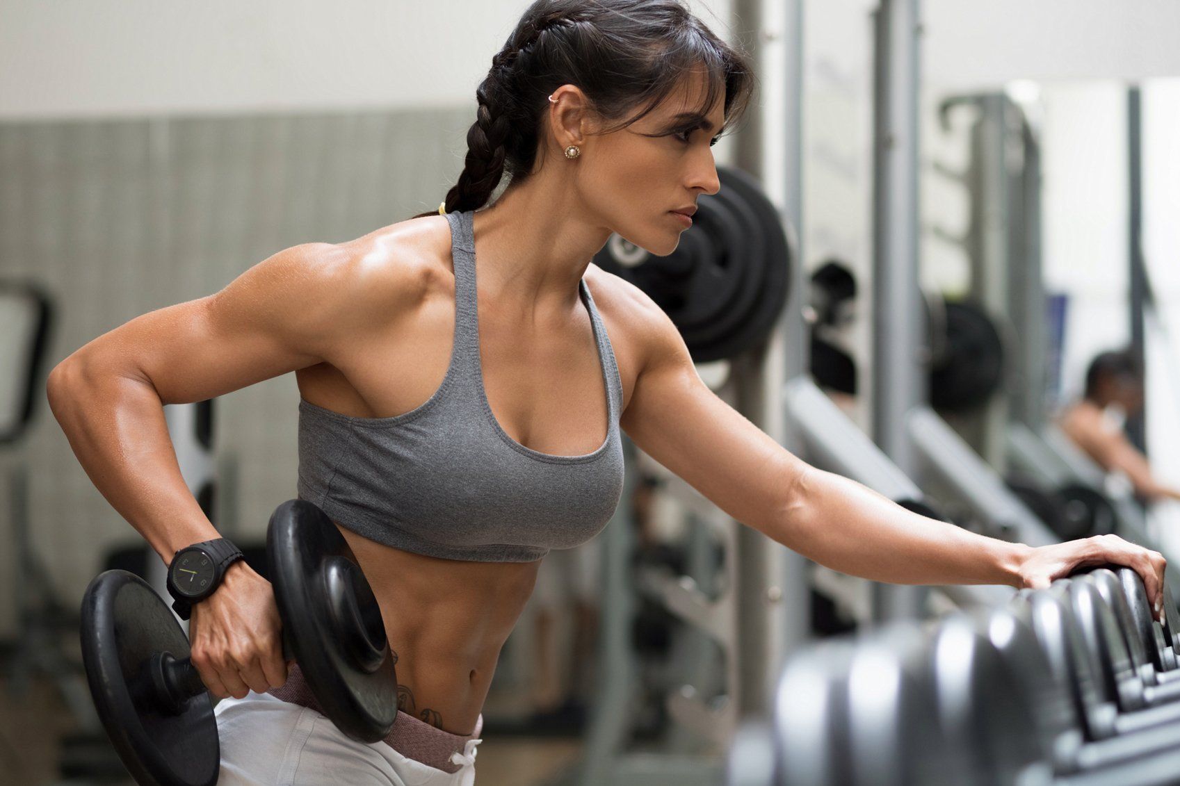 Woman Lifting Dumbbells — Keysborough, VIC — Recreation Gym Keysborough