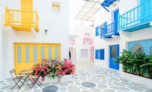 A house with a car parked in front of it.