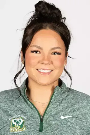 A woman wearing a green nike sweatshirt is smiling for the camera.