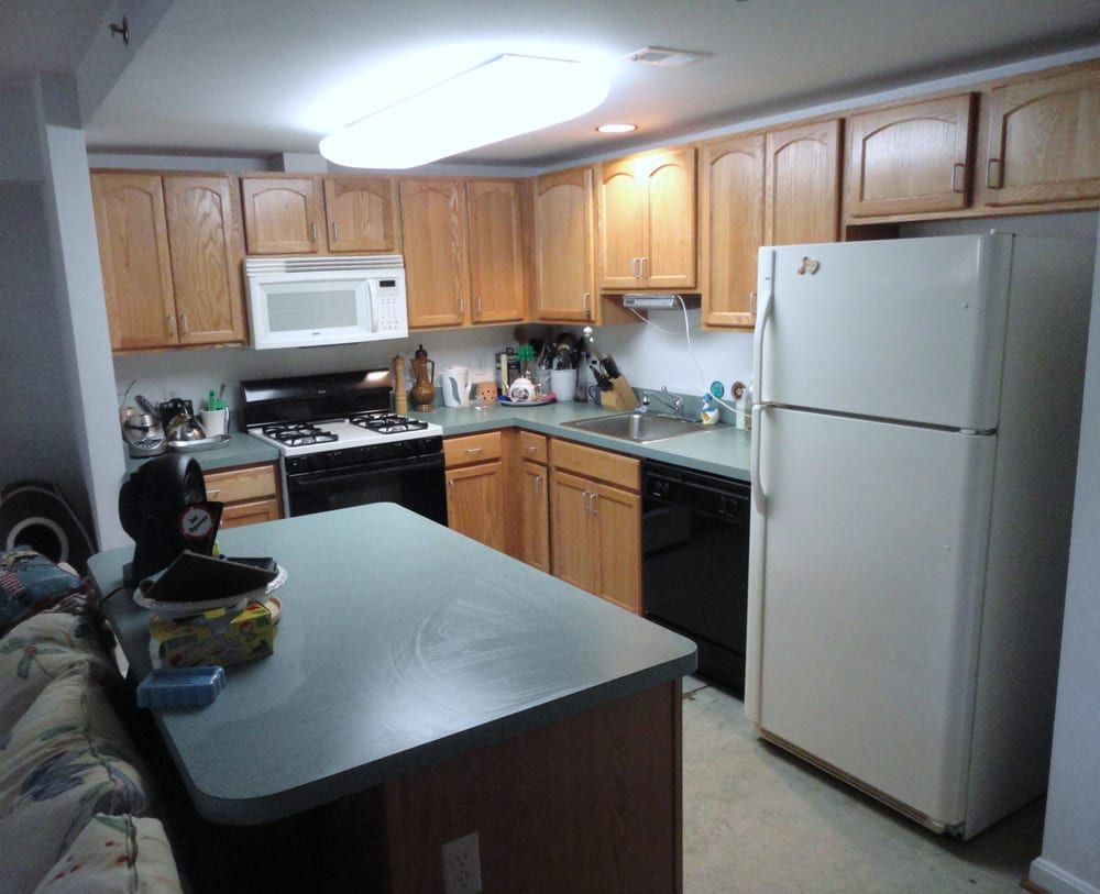 A kitchen with a refrigerator that has the number 20 on it