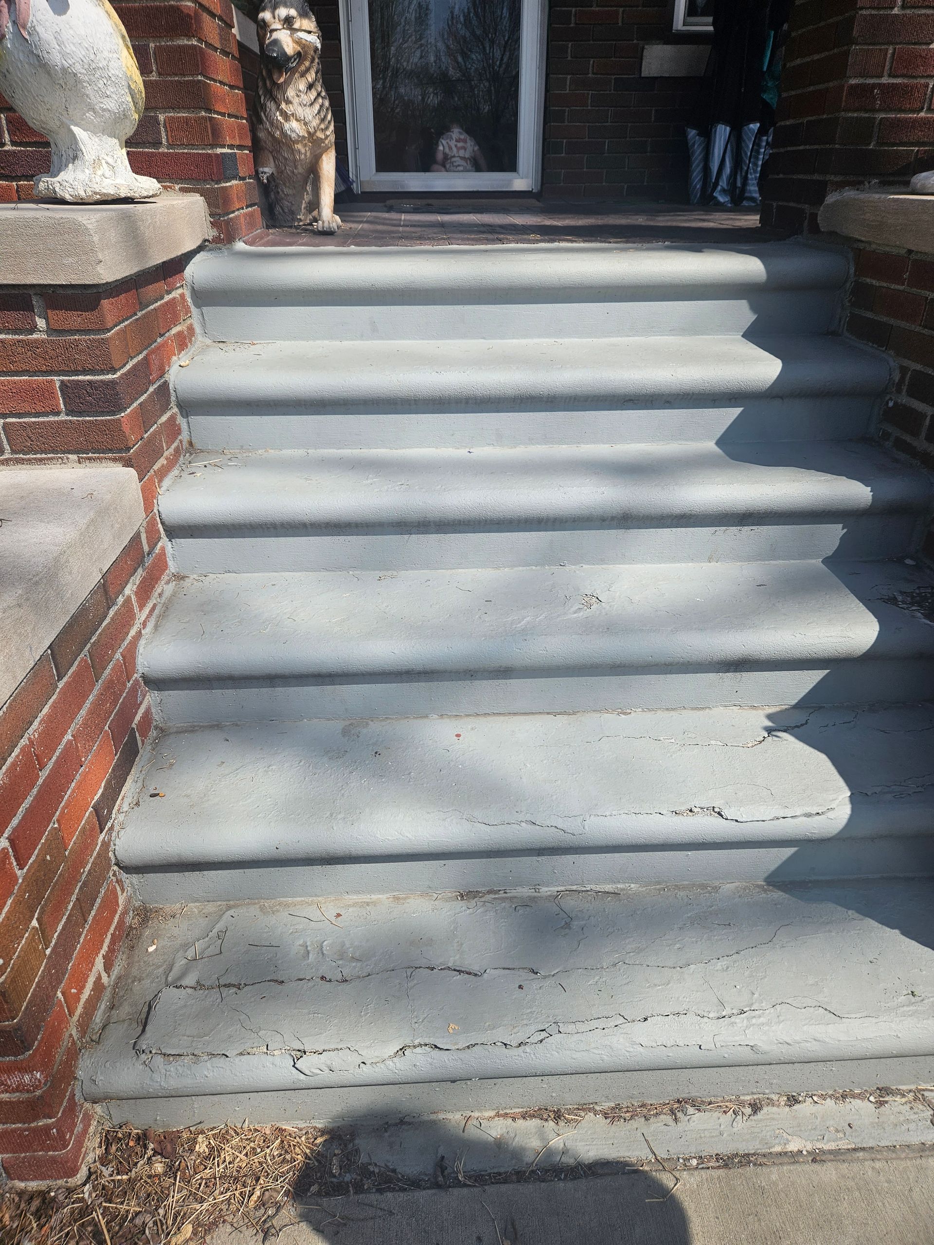 A set of stairs leading up to a brick building.