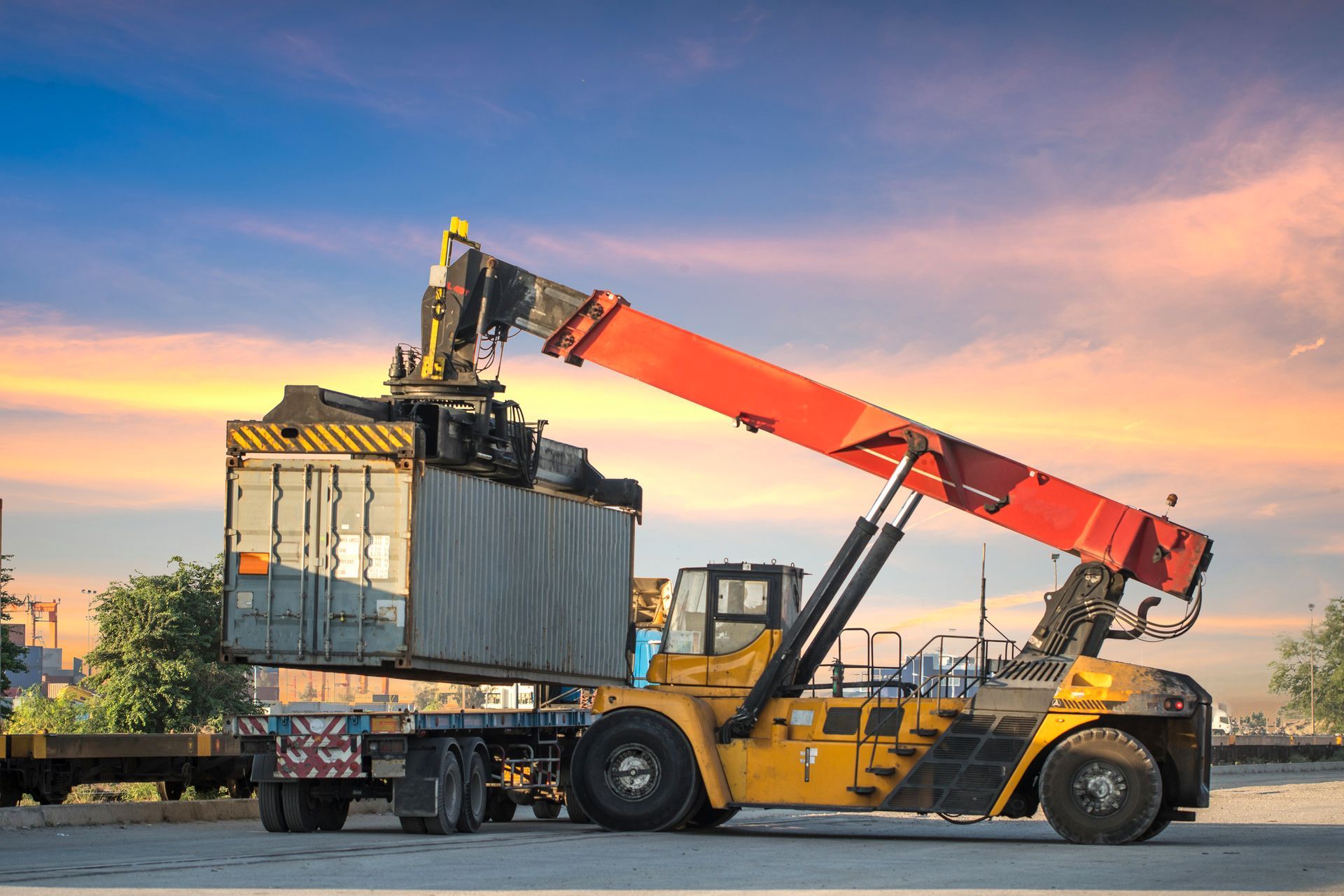 Boom lift and an industrial container cargo.