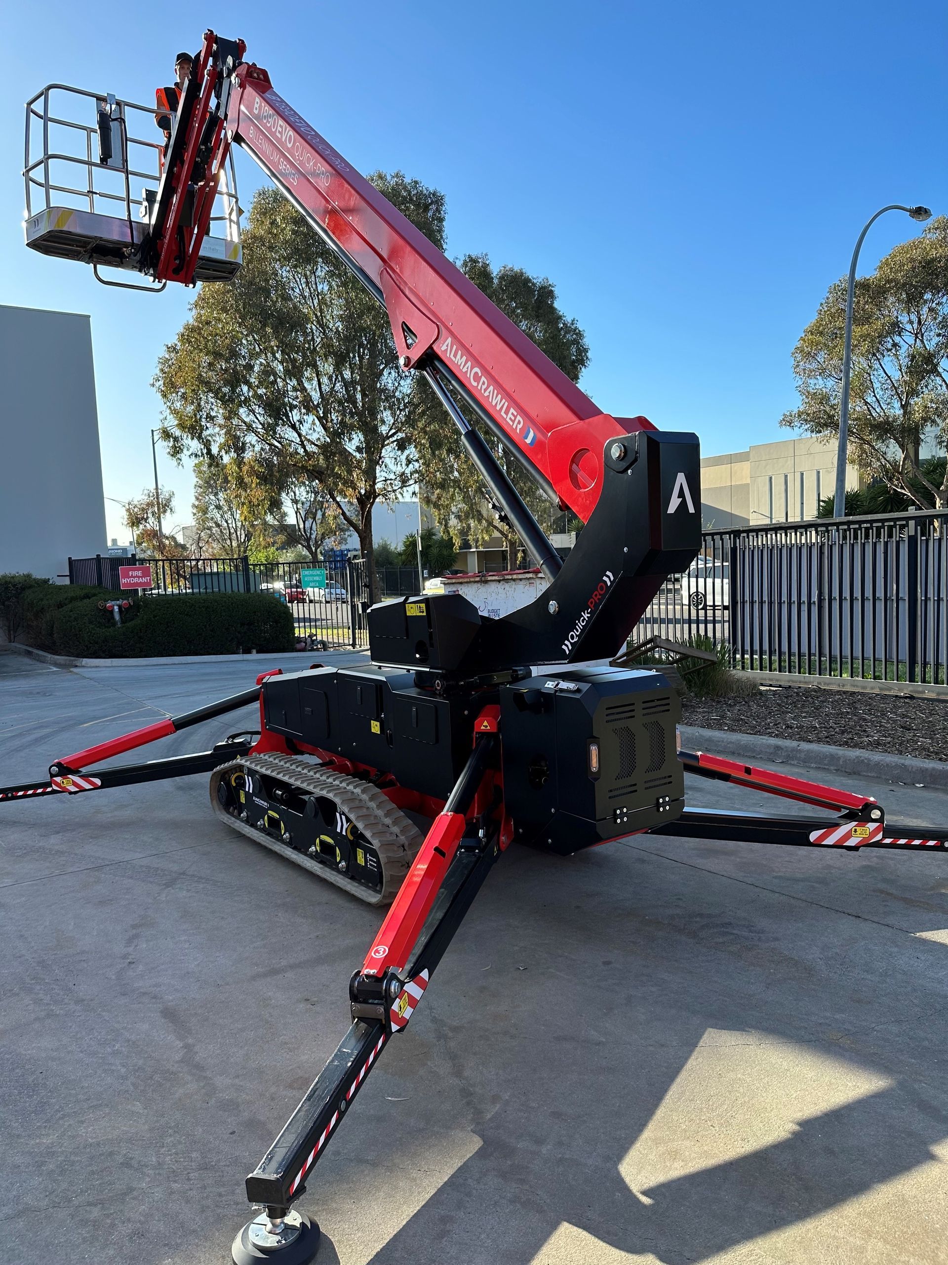 A jlg scissor lift is parked in a parking lot