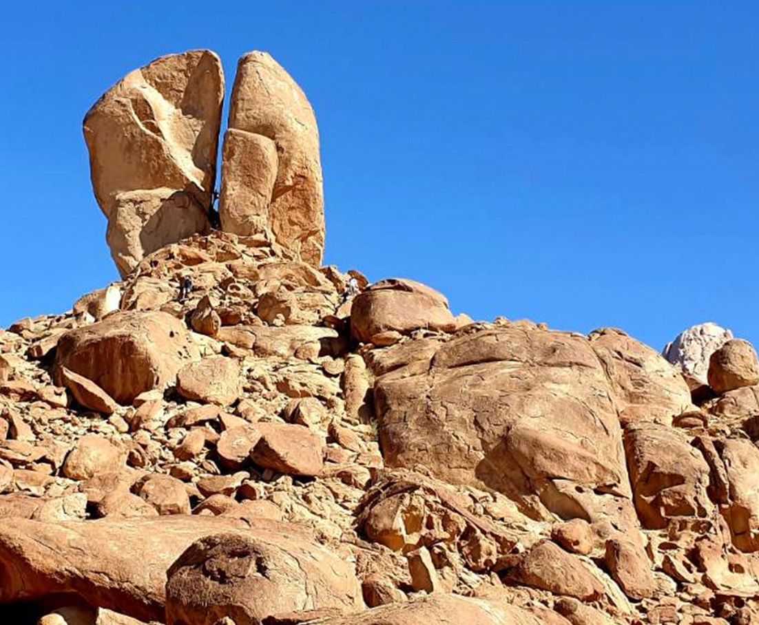 The Split Rock of Moses at Rephadim desert with a blue sky in the background