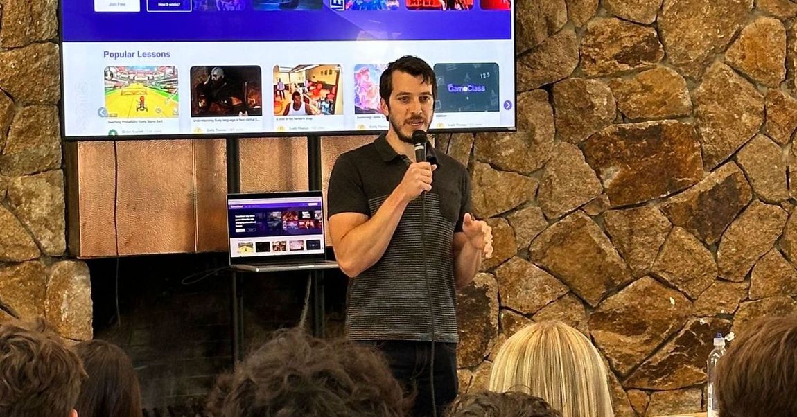 A man is giving a presentation in front of a group of people.