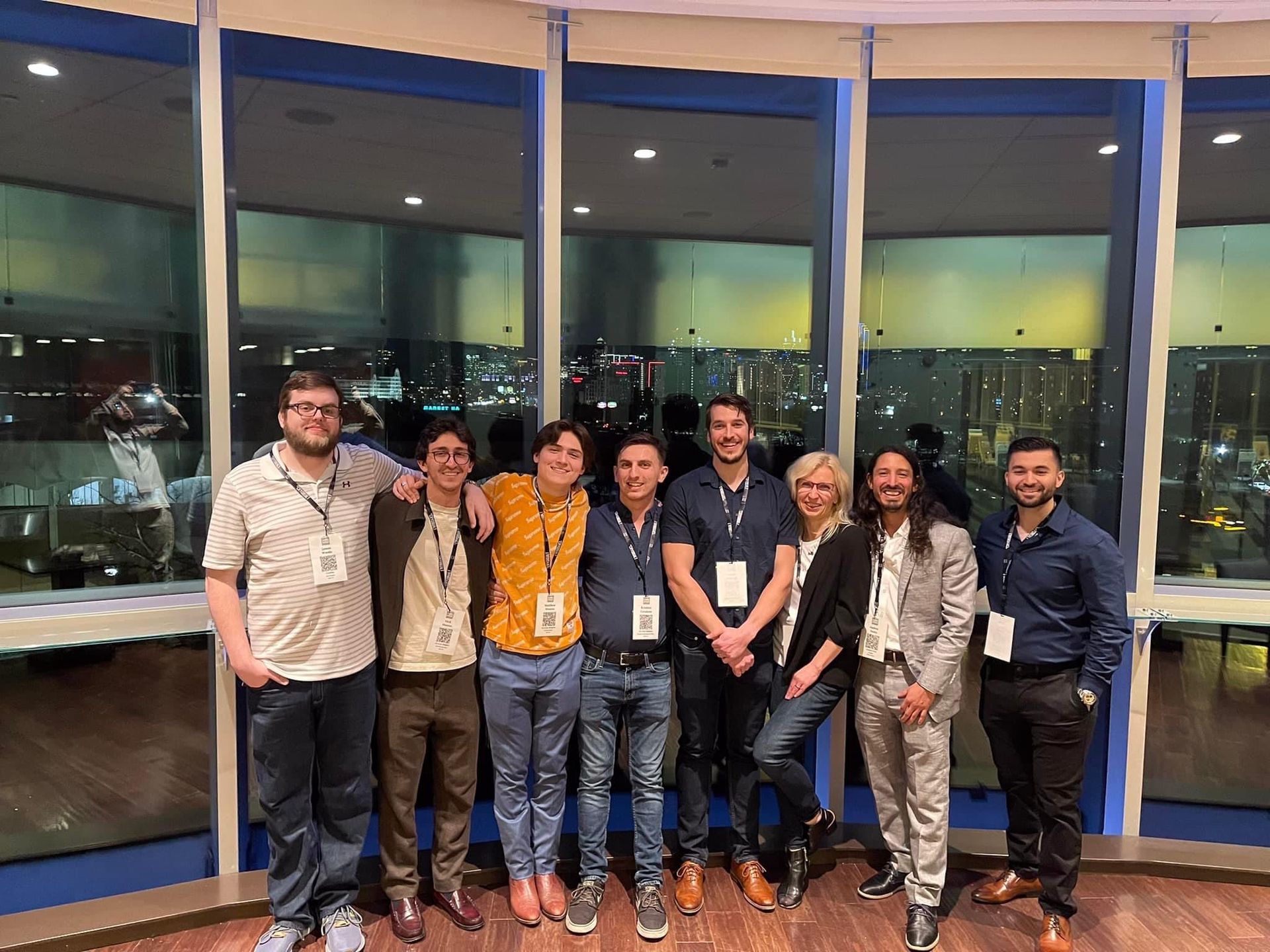 a group of people are posing for a picture in front of a window with Skyler Scarlett from Shark Tank cryo fame