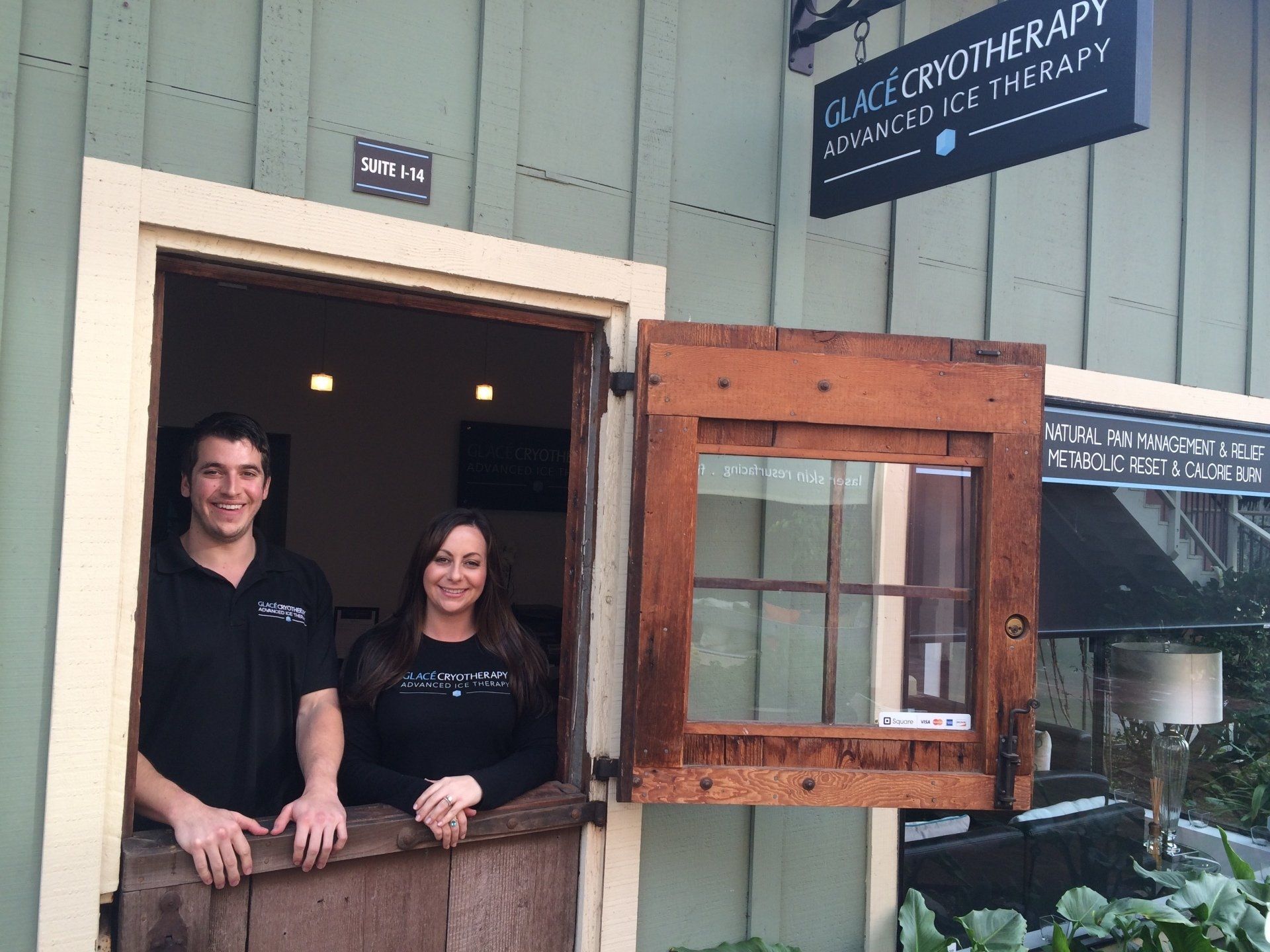 a man and a woman are standing in front of a building that says Glace Cryotherapy