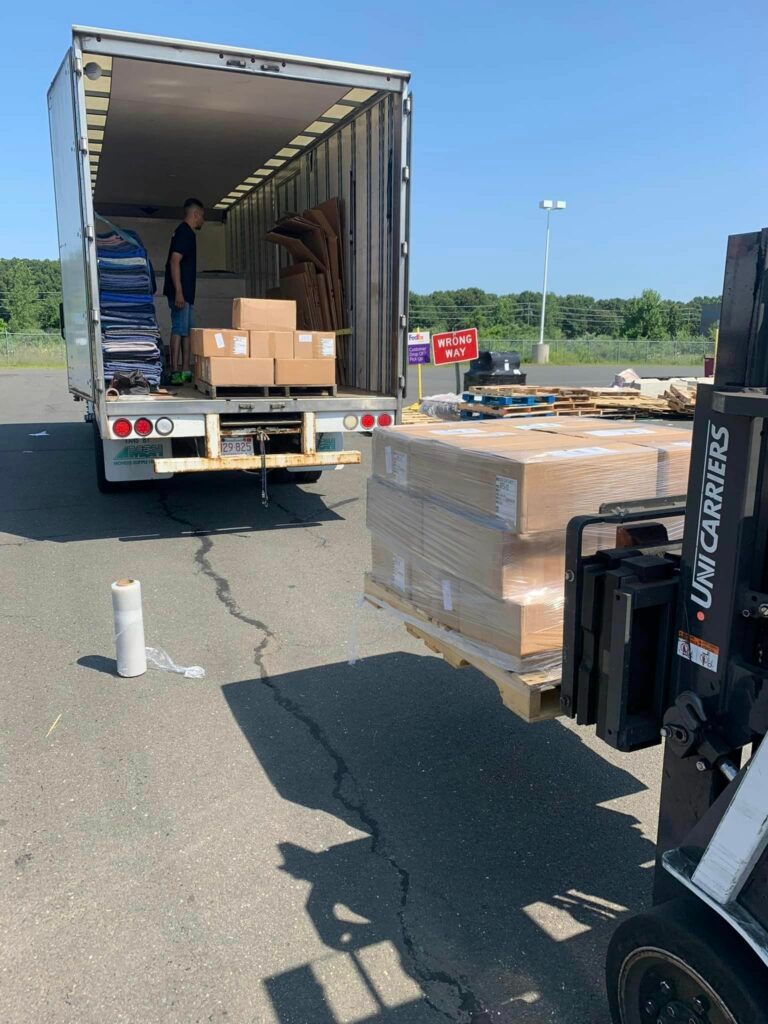 Forklift Loading Boxes on Truck | West Springfield, MA | A to Z Moving & Storage