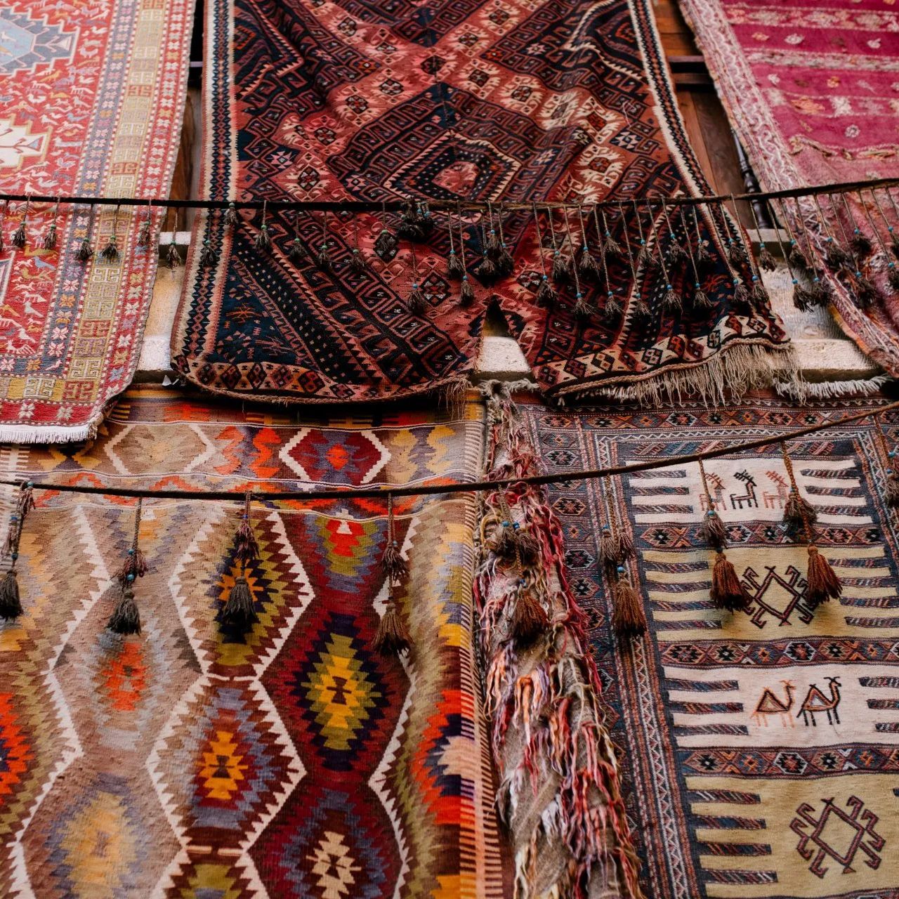 a spread of a variety of different oriental rugs