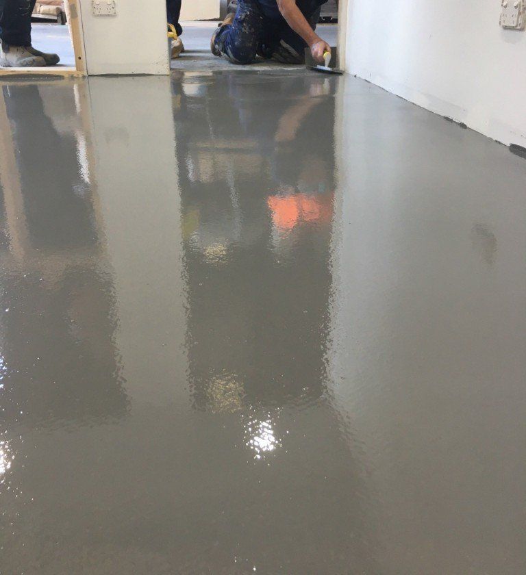 Leveling newly poured concrete