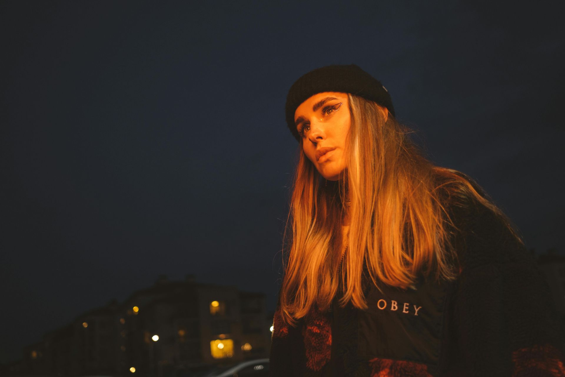 lady with obey shirt on