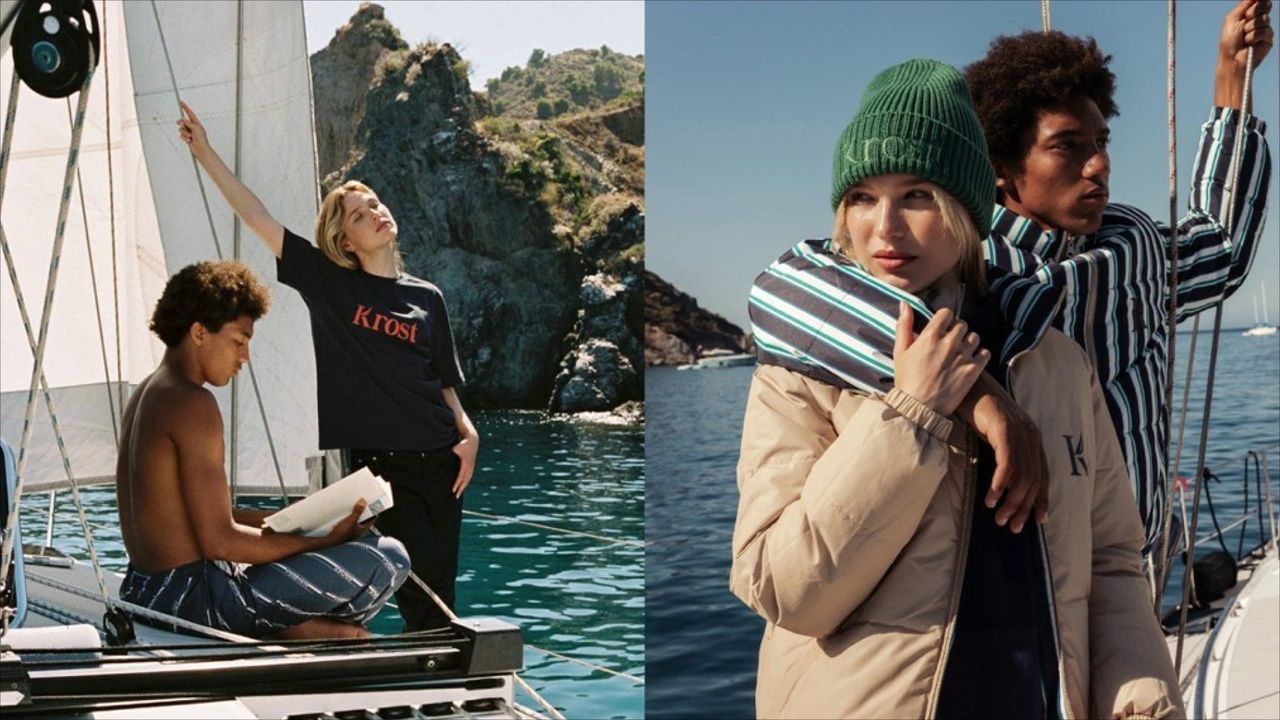 A man and a woman are sitting on a boat in the water.