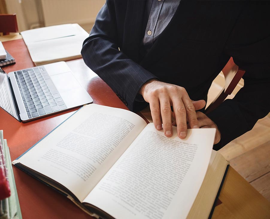Divorce Attorneys Duluth Ga — Lawyer Reading A Book in Duluth, GA Divorce Attorneys Duluth Ga — Lawyer Reading A Book in Duluth, GA