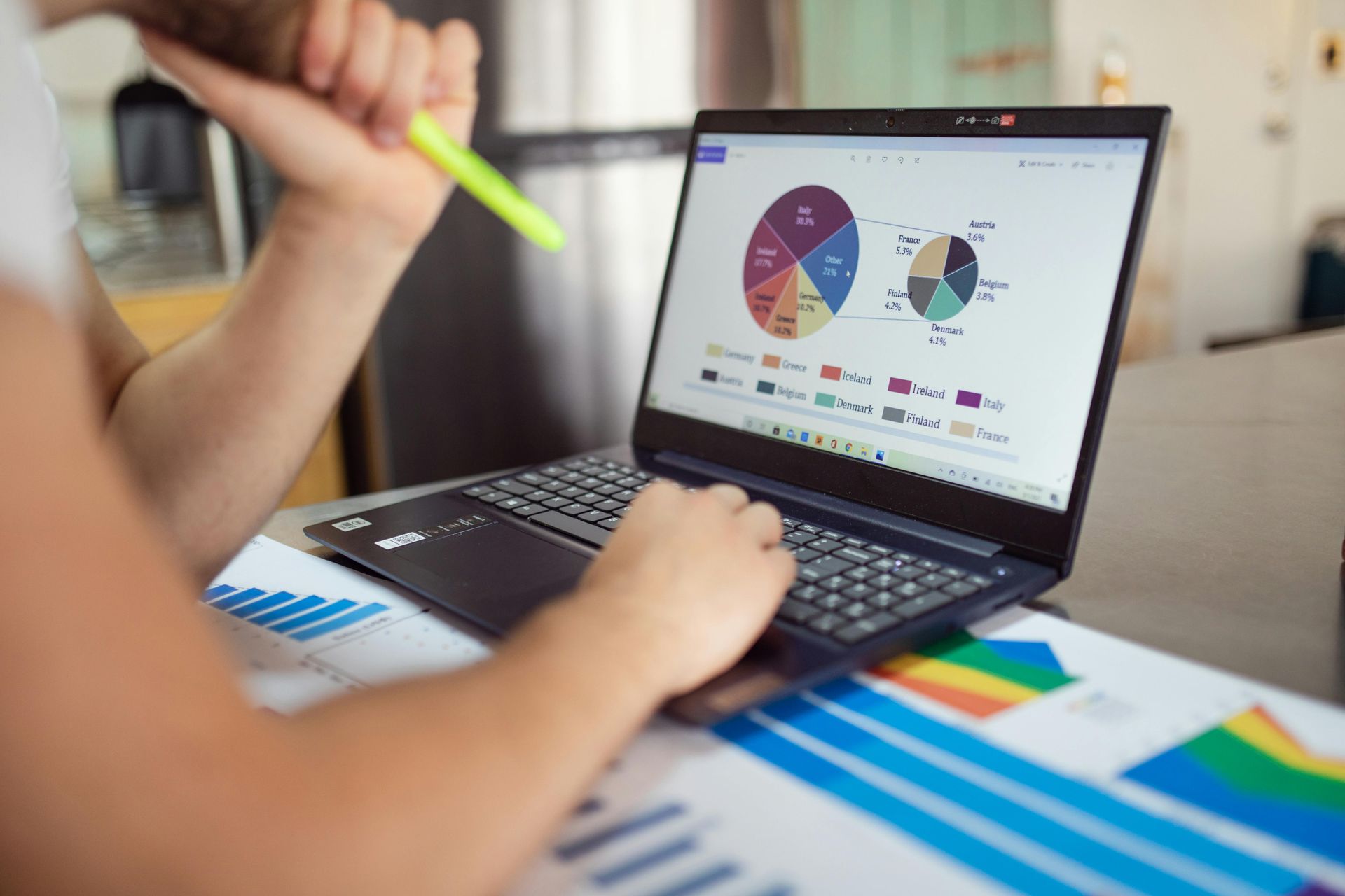 Picture of a laptop showing a pie chart and a drill-down of one of the pie chart categories