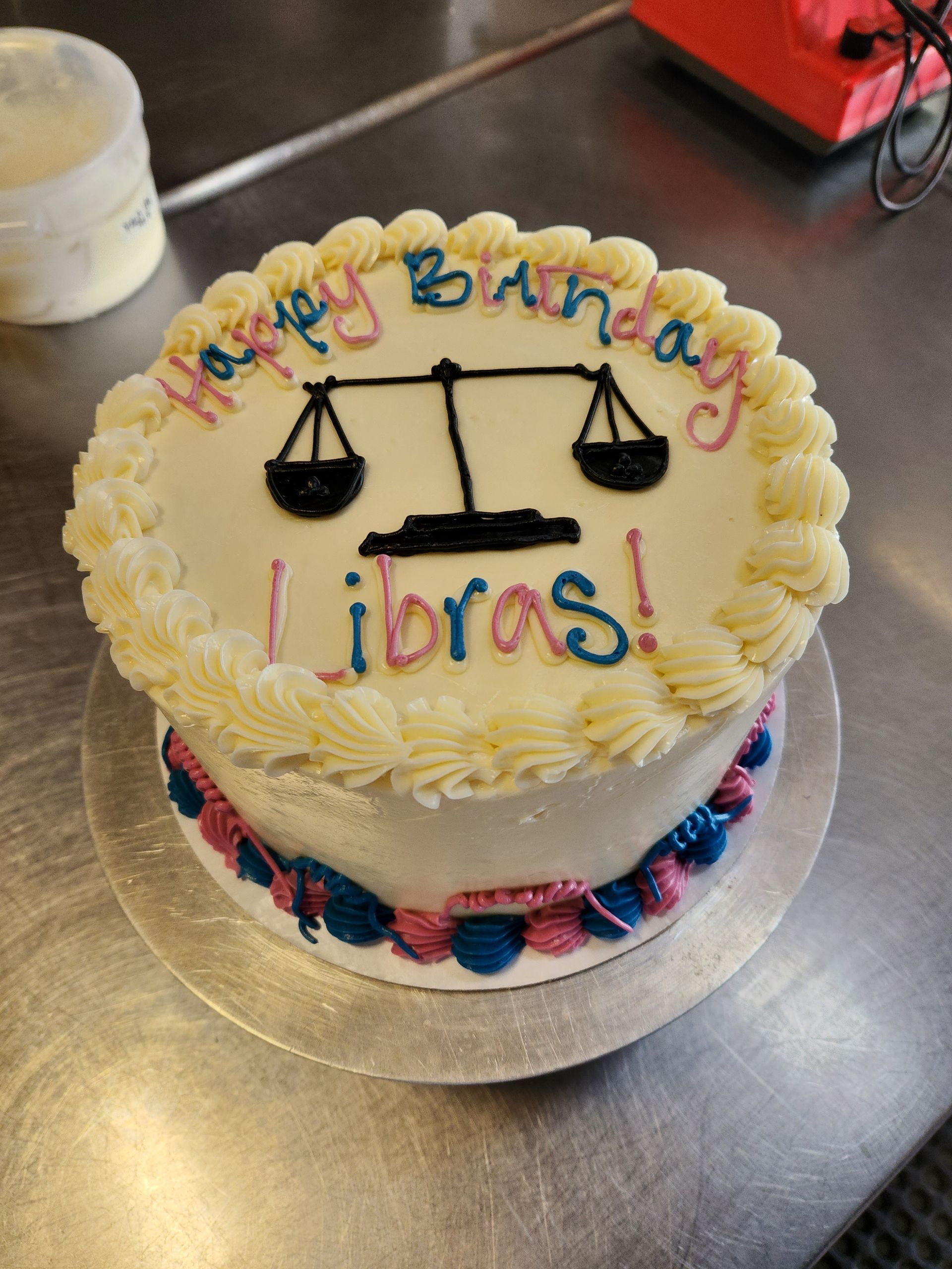 A birthday cake with libras written on it