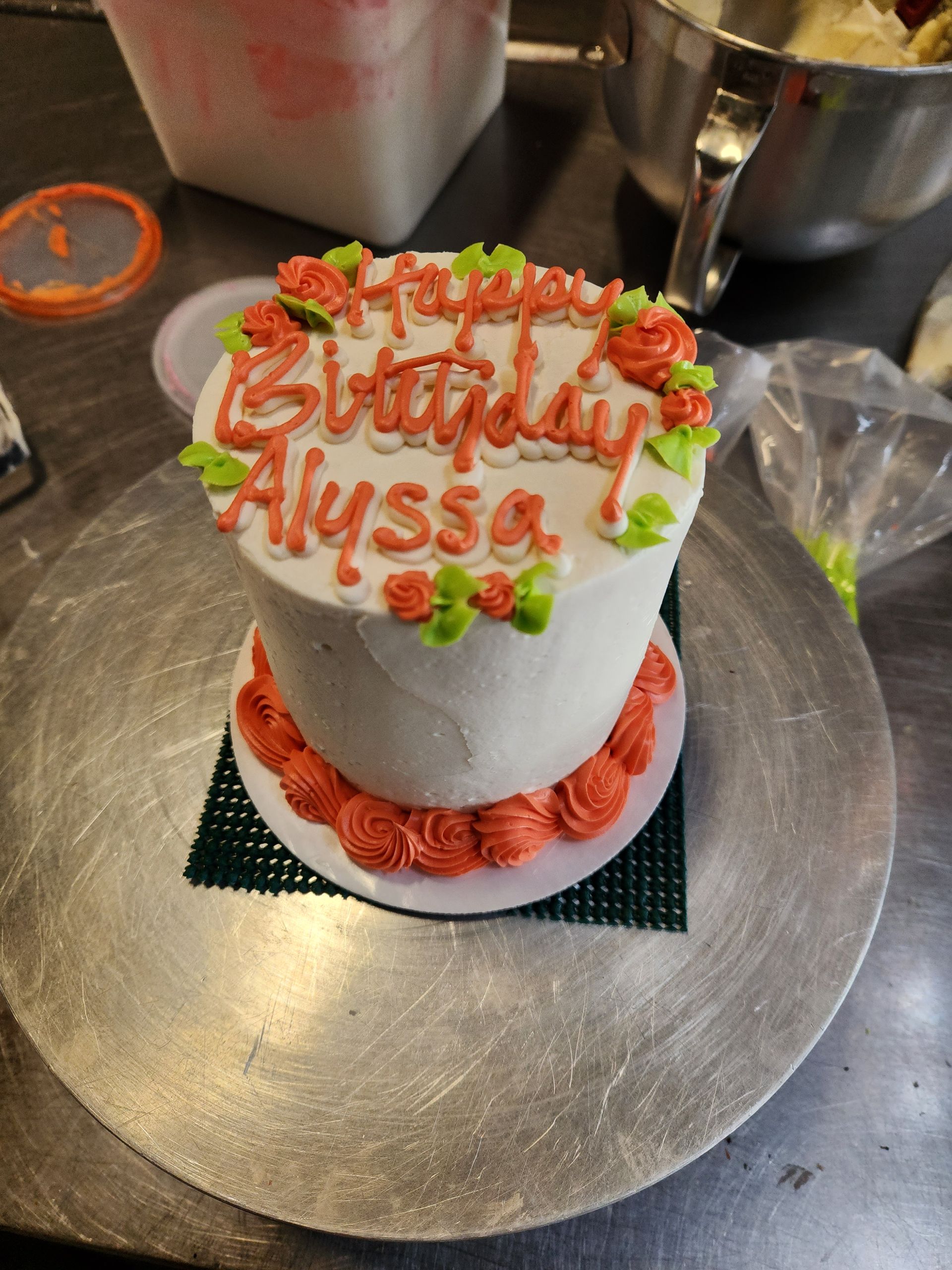 A birthday cake with the name alyssa on it