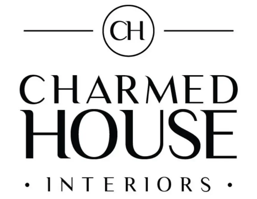 The logo for charmed house interiors is black and white.