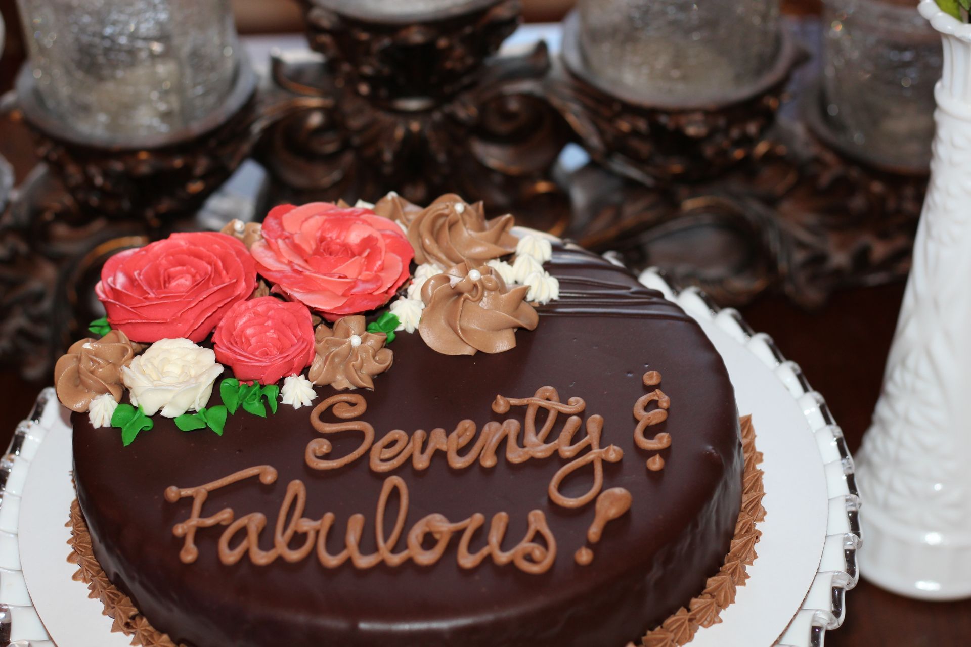 A chocolate cake that says seventy and fabulous on it