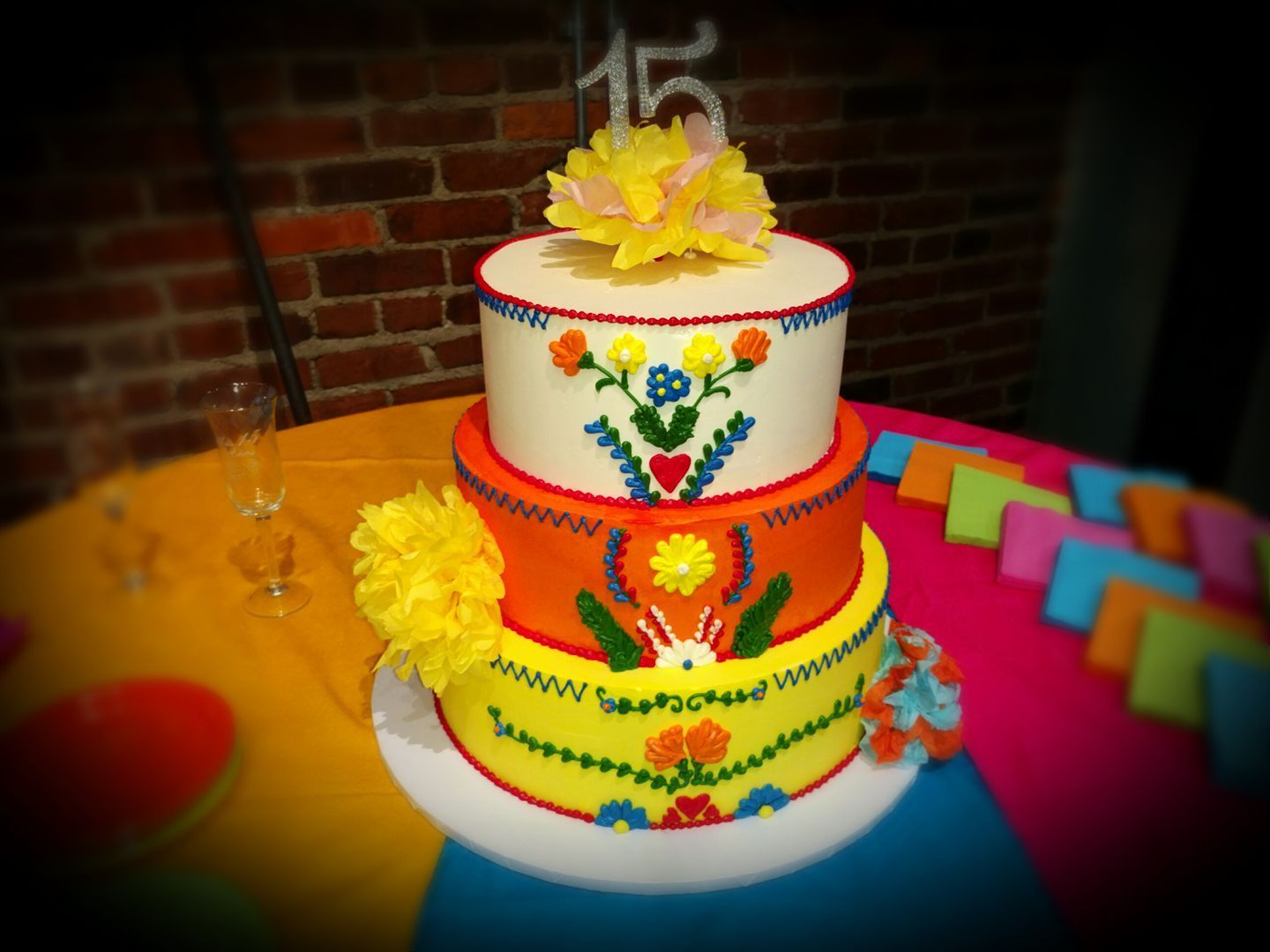 A colorful cake with the number 15 on top