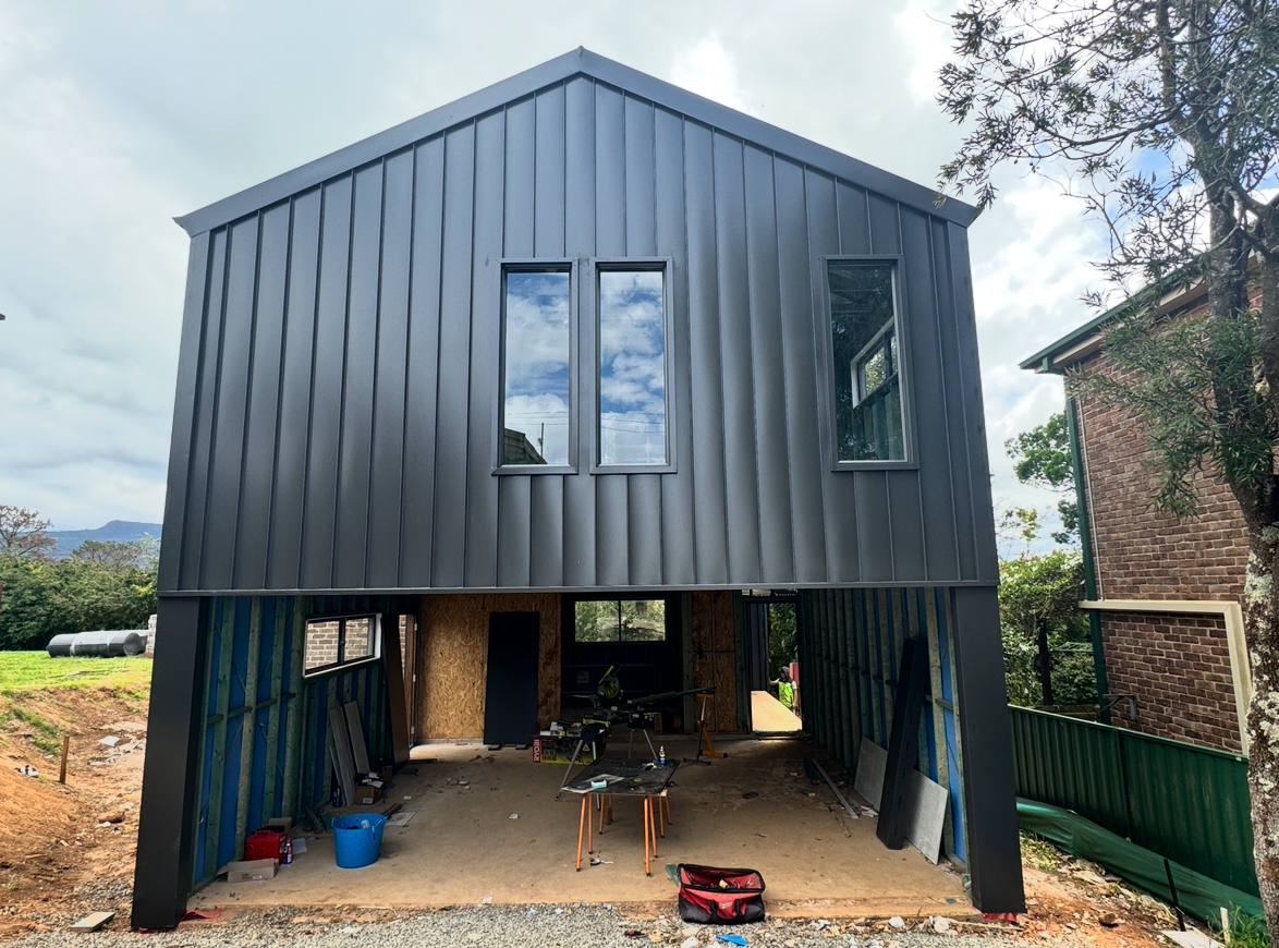 There Are Two Skylights On The Roof Of A Building — Elevated Roofing Systems Pty Ltd In Barrack Heights, NSW