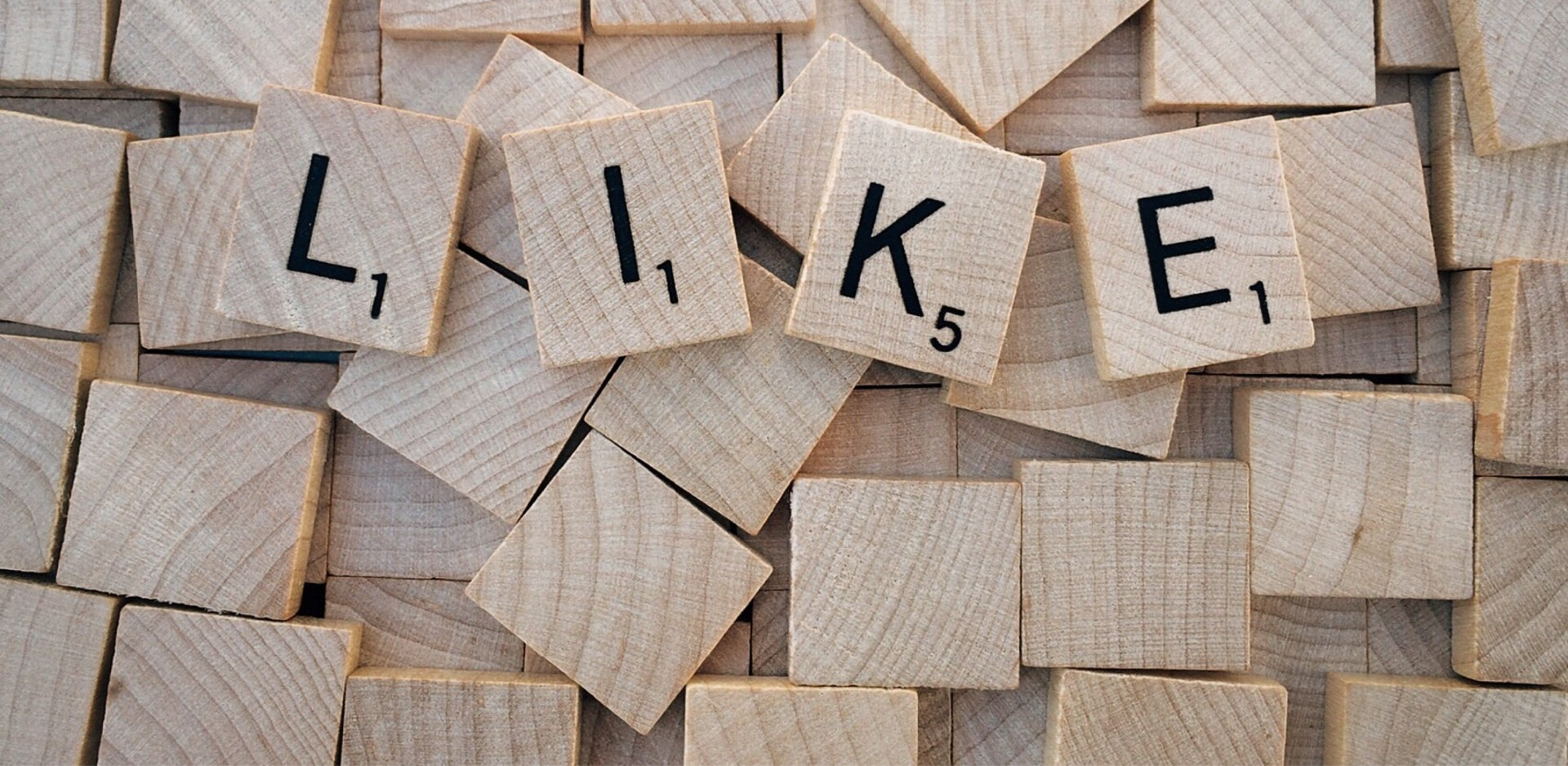 The word like is written on wooden scrabble tiles