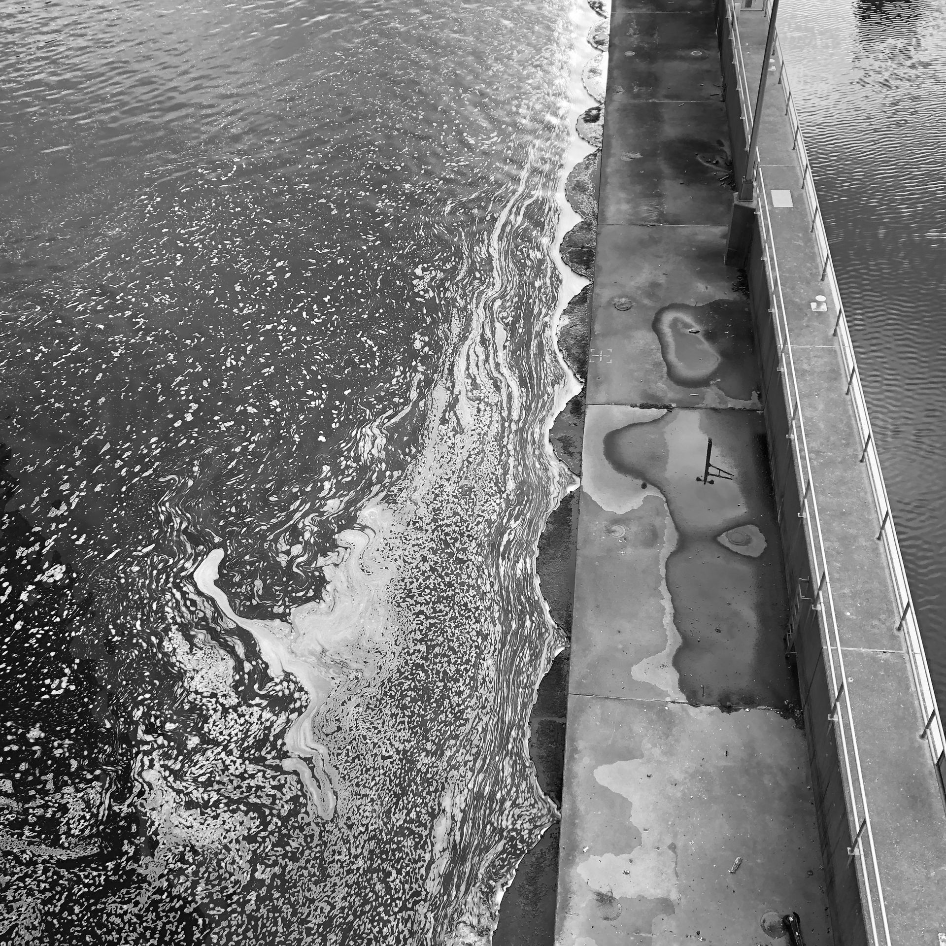 A black and white photo of a body of water