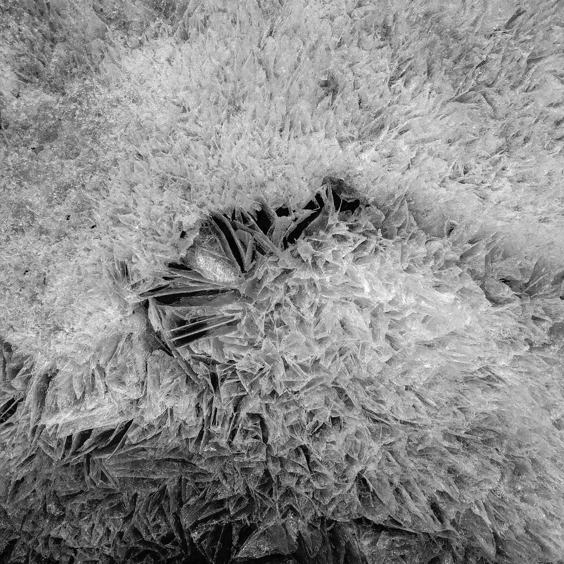 A black and white photo of a pile of ice.