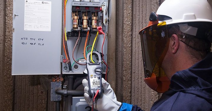 man working on electrical unit