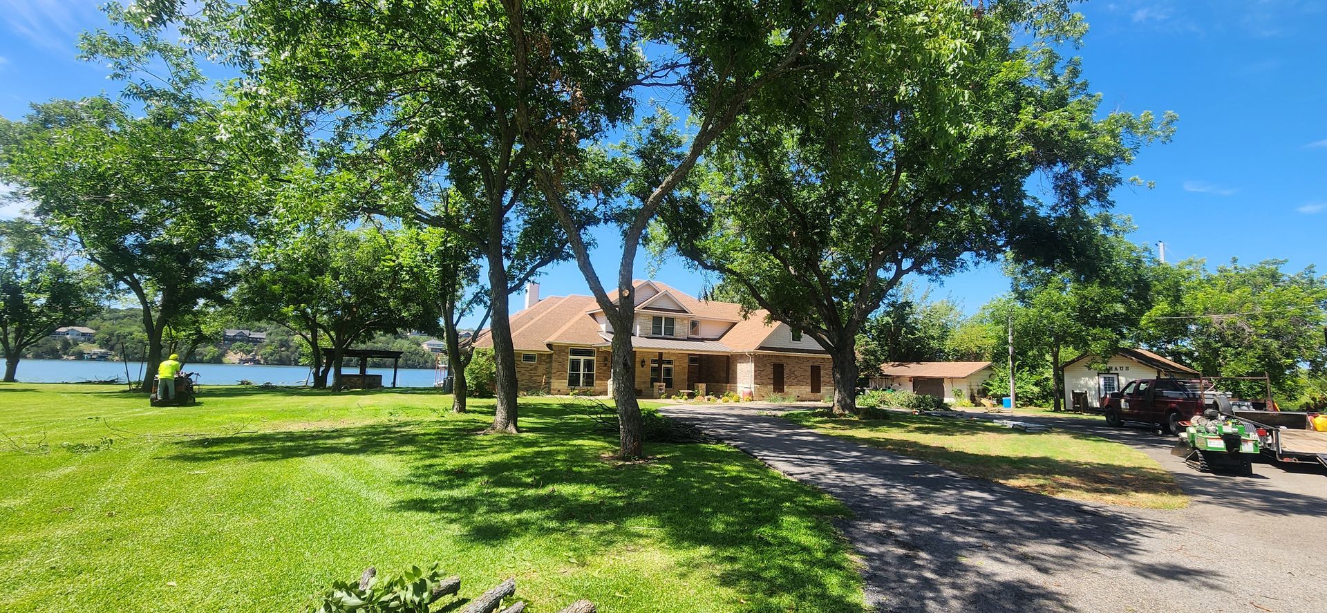 Large shade tree in a Cleburne, TX backyard providing cooling shade.
