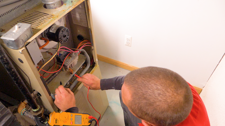 Technician testing furnace system.