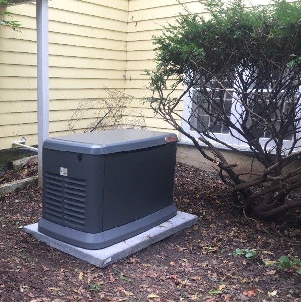 A Honeywell Generator installed in the rear of a residential home.