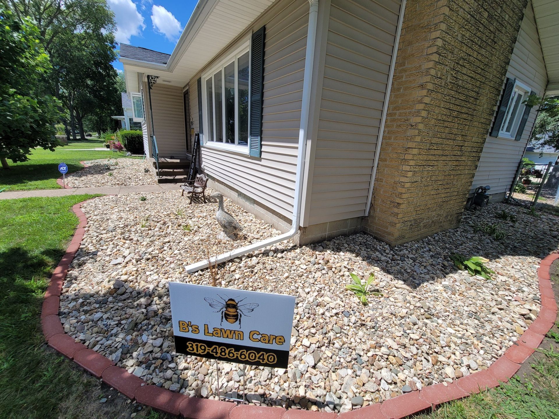 A house with a sign on the side of it.