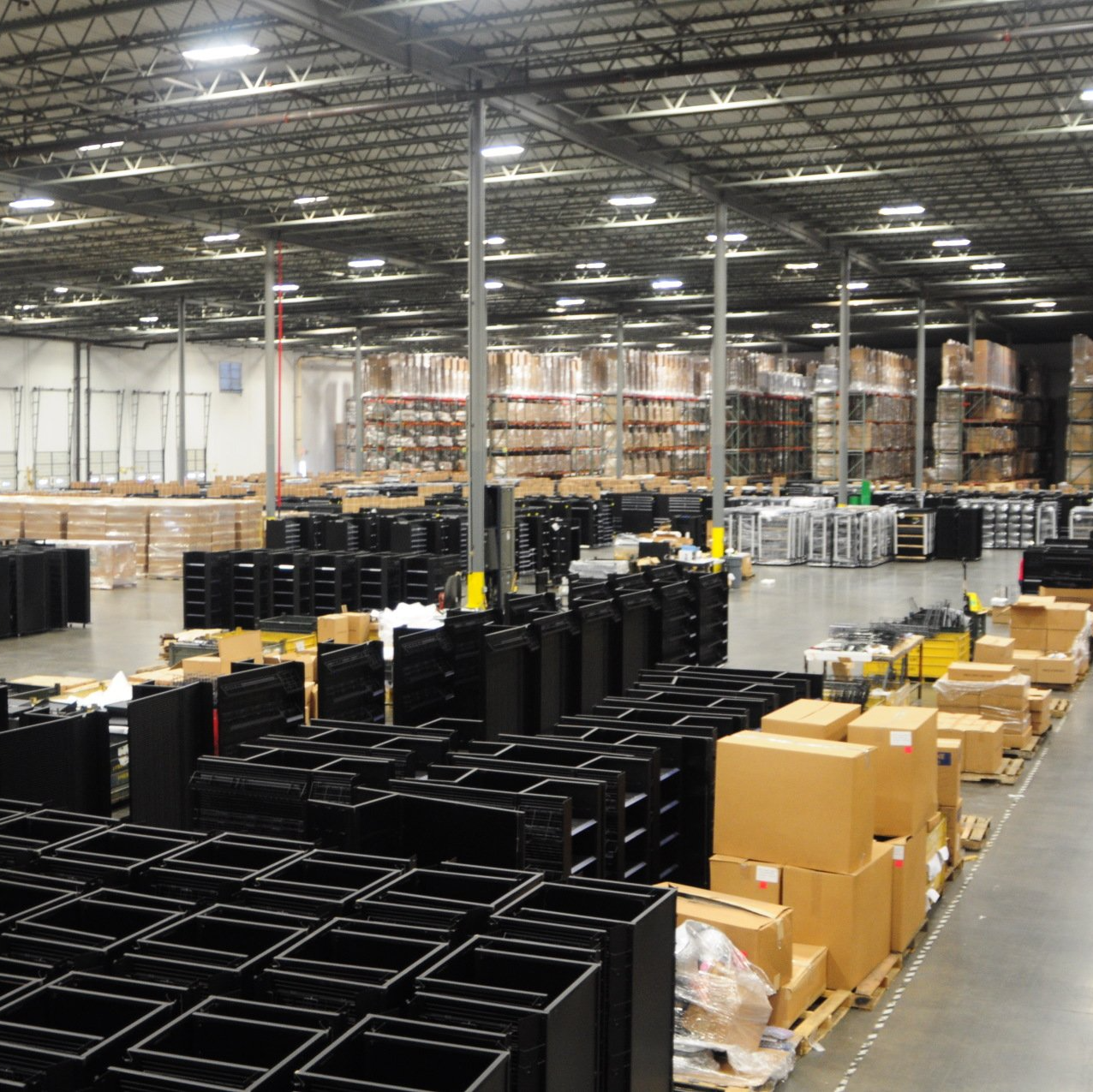 A large warehouse filled with lots of boxes and shelves