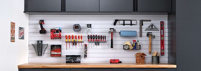 garage slatwall with tools organized and custom garage cabinets 